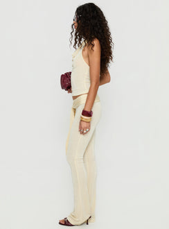 side view of model wearing Princess Polly Butterfly Tie Detail Pants Lemontini Mid Rise Pants 