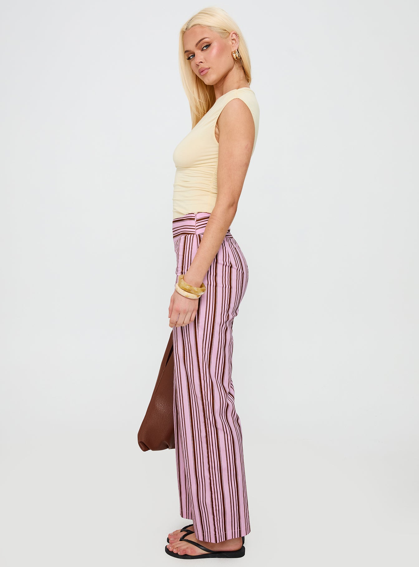 side view of model wearing Princess Polly Leocadie Pants Pink Stripe High Waisted Pants 