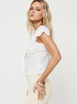 side view of model wearing Princess Polly Tullock Top White Low Impact Short Sleeves V-Neck 