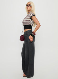 side view of model wearing Princess Polly Ramos Low Rise Wide Leg Jeans Dark Grey Wash Low Rise Jeans 