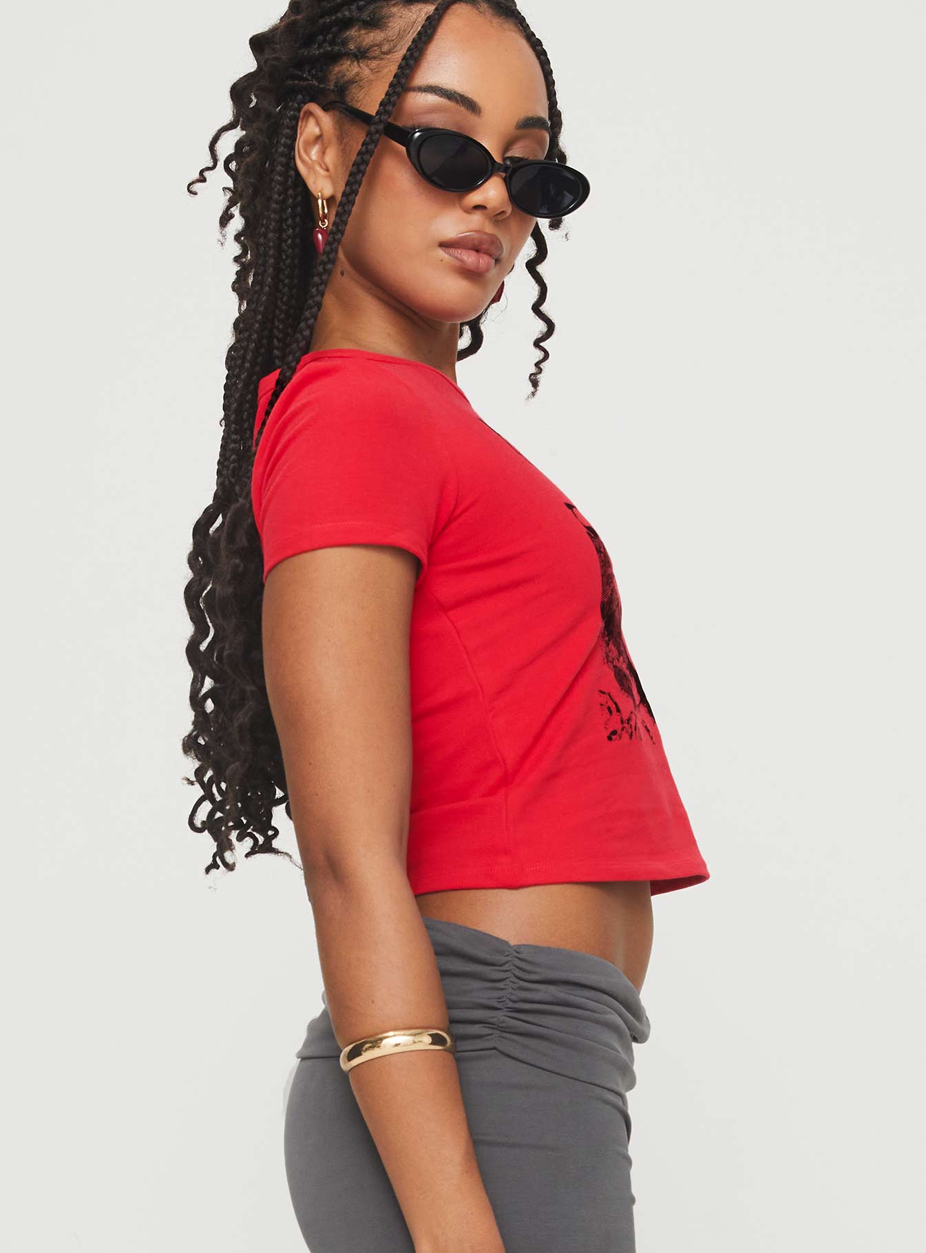 side view of model wearing Princess Polly Akeko Tee Red Short Sleeves Crew Neck 