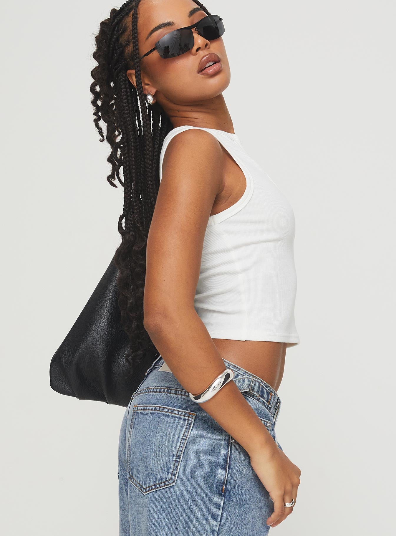 side view of model wearing Princess Polly Somer Top White Sleeveless Scoop Neck 