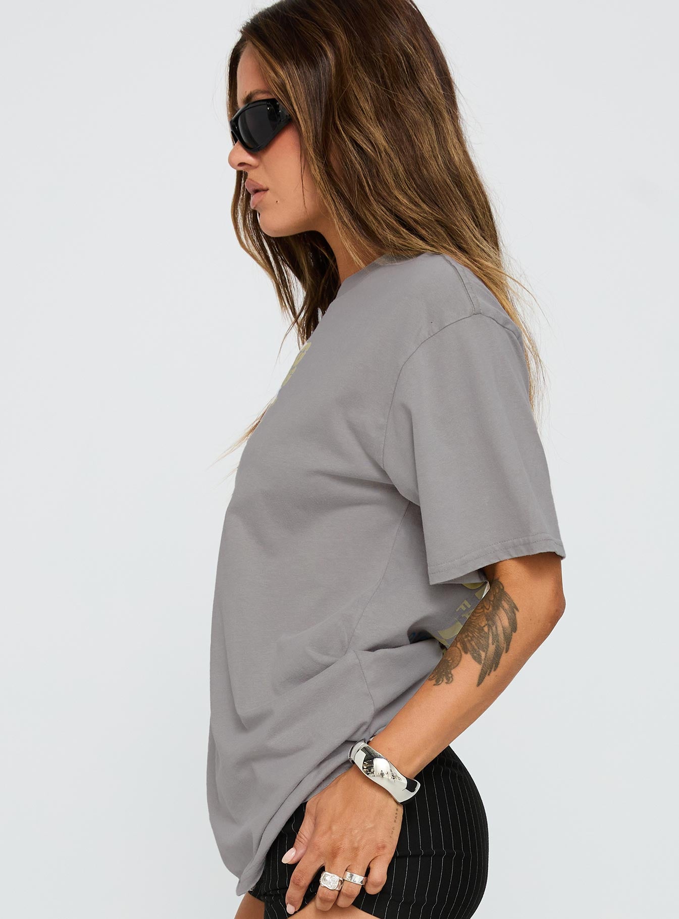 side view of model wearing Princess Polly Dodge Racer Oversized Graphic Tee Grey Half Sleeves Crew Neck 