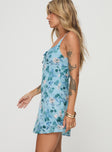 side view of model wearing Princess Polly Mercure Mini Dress Blue Floral Square Neck 