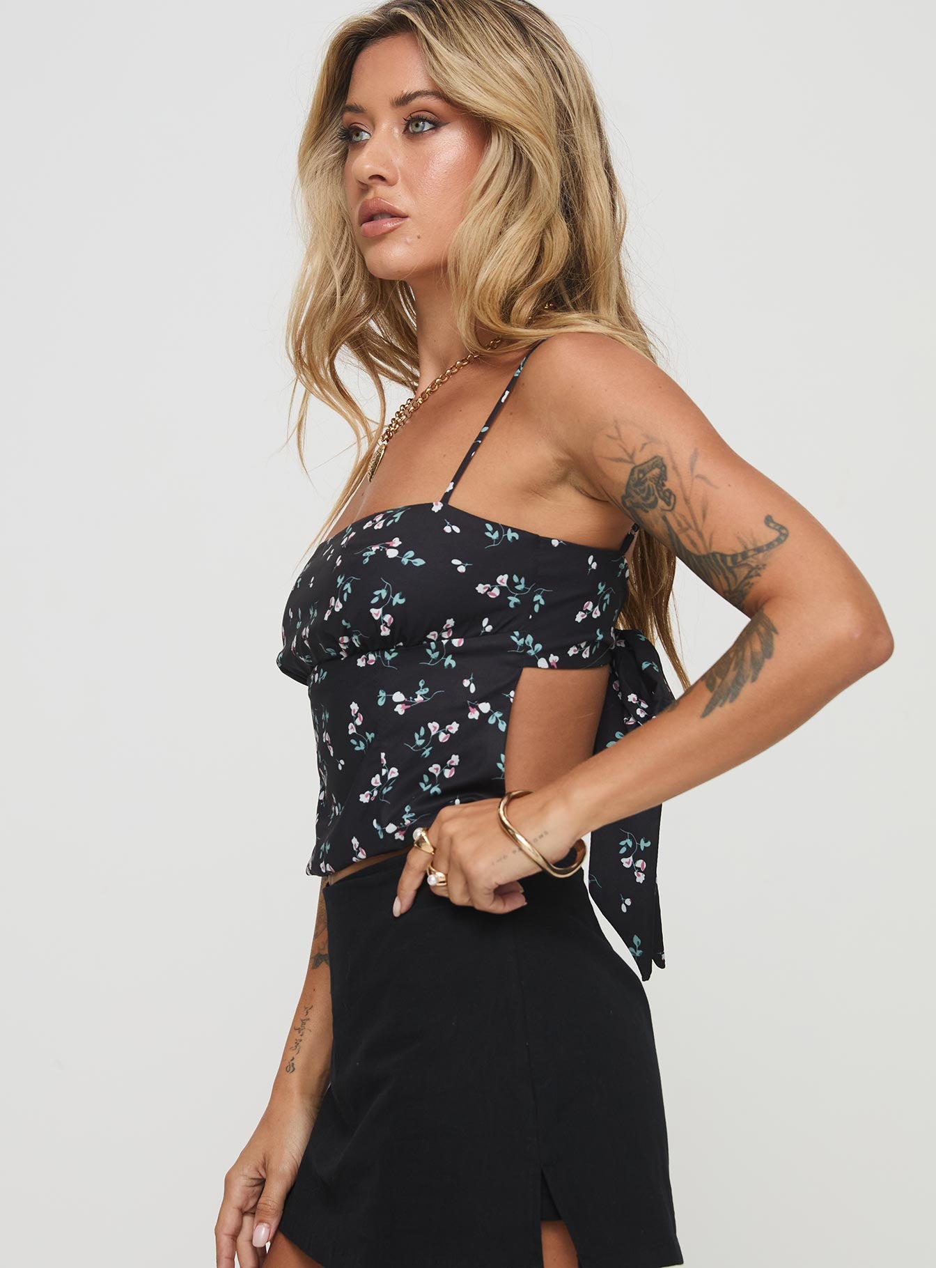 side view of model wearing Princess Polly Orionis Top Black Sleeveless Square Neck 