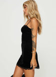 side view of model wearing Princess Polly Rishan Velvet Mini Dress Black Square Neck 