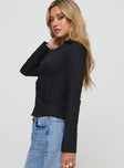 side view of model wearing Princess Polly Zifa Shirt Black Full Sleeves V-Neck 