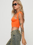 side view of model wearing Princess Polly Bolden Top Orange Short Sleeves Plunger 