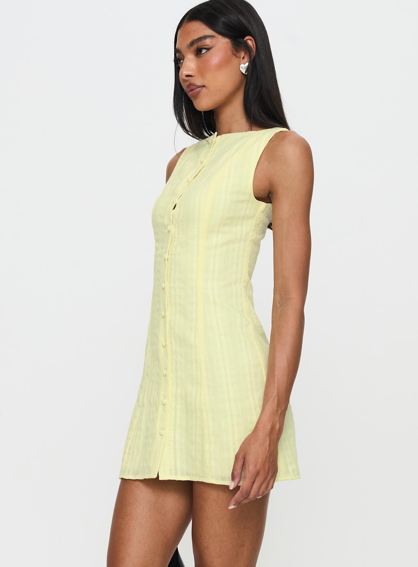 side view of model wearing Princess Polly Mimsie Embroidered Mini Dress Lemon Boat Neck 