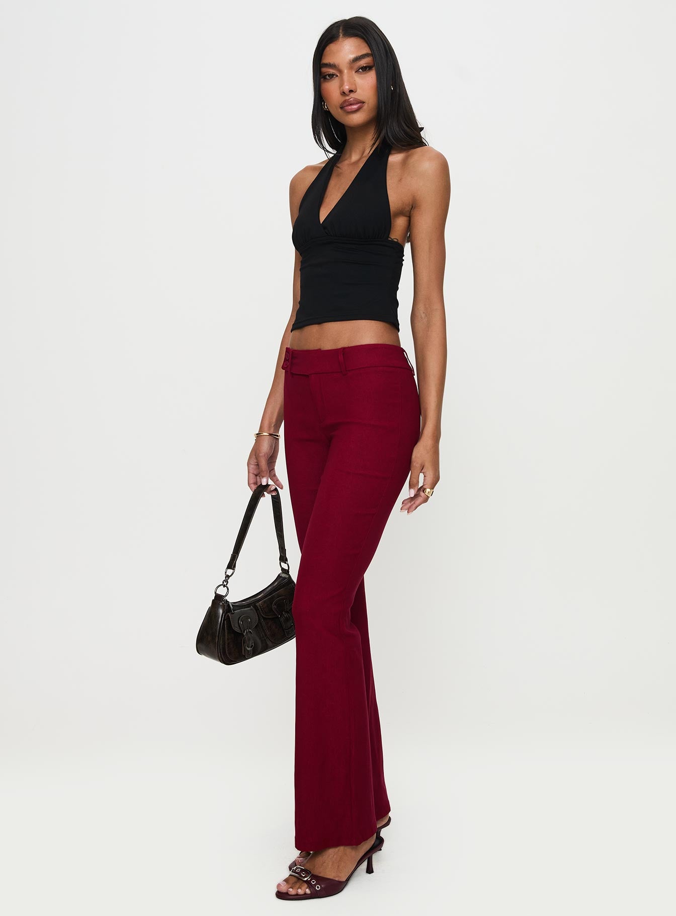 back view of model wearing Princess Polly Kinkirk Flared Pants Burgundy Low Rise Pants 