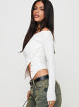 side view of model wearing Princess Polly Karre Off The Shoulder Long Sleeve Top White Full Sleeves Asymmetric Neckline 