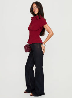 side view of model wearing Princess Polly Magic Mirror Mid Rise Bootleg Jeans Raw Indigo Mid Rise Jeans 