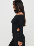 side view of model wearing Princess Polly Maestro Off The Shoulder Top Black Full Sleeves straight 