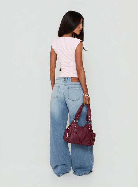 Crafted from Lokura Low Rise Super Baggy Jeans Vintage Mid Blue Wash womens-jeans back view of model wearing Princess Polly