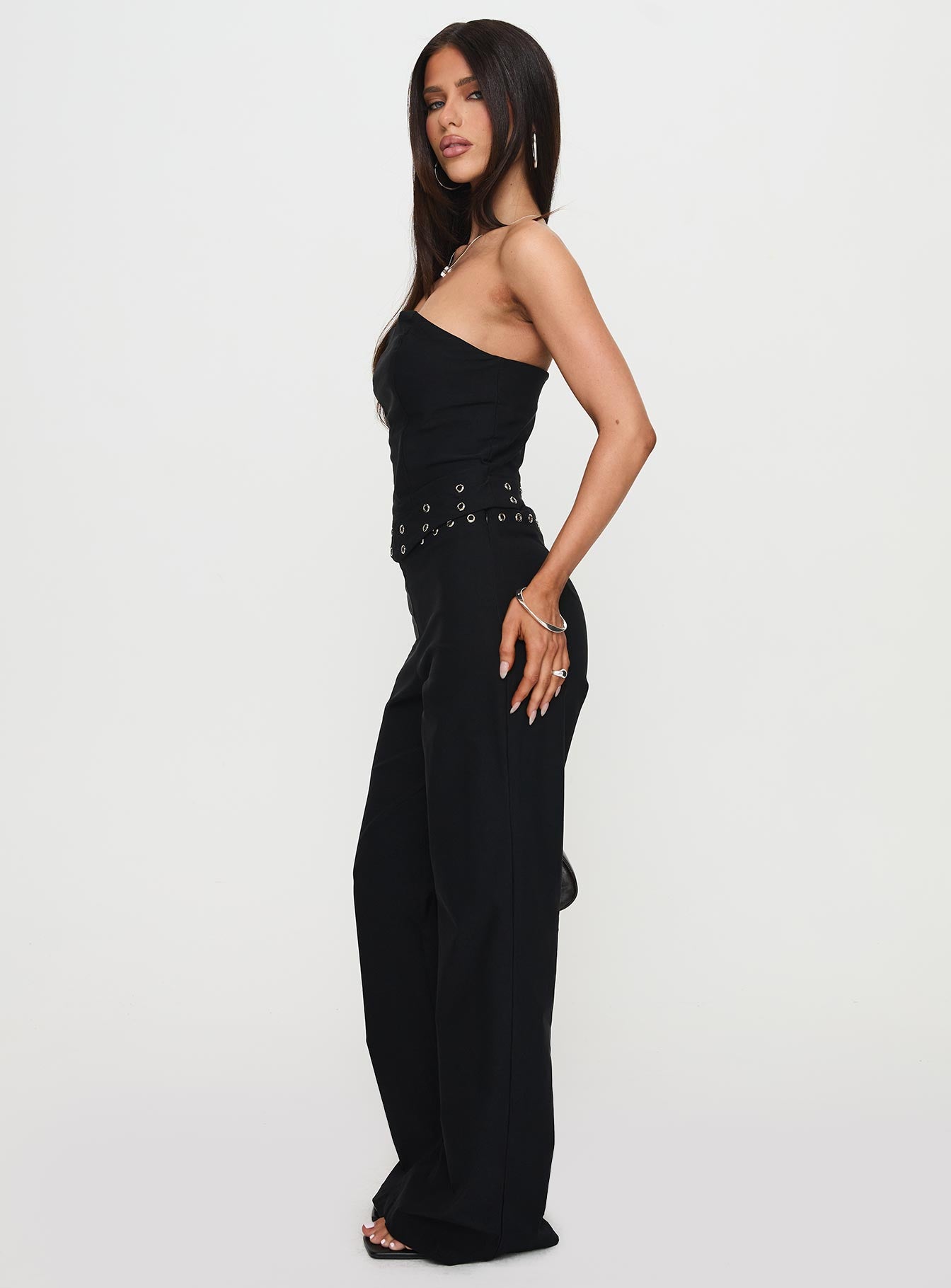 side view of model wearing Princess Polly Passionette Pants Black Petite High Waisted Pants 