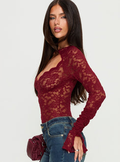 side view of model wearing Princess Polly Giallo Long Sleeve Bodysuit Burgundy Long Sleeve Tops 
