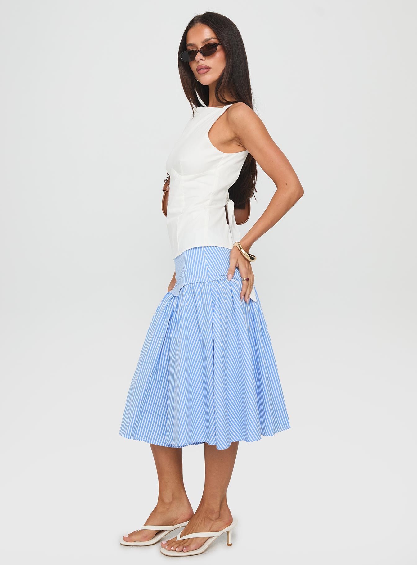   side view of model wearing Princess Polly Raelan Tiered Midi Skirt Blue Stripe Midi Skirts 
