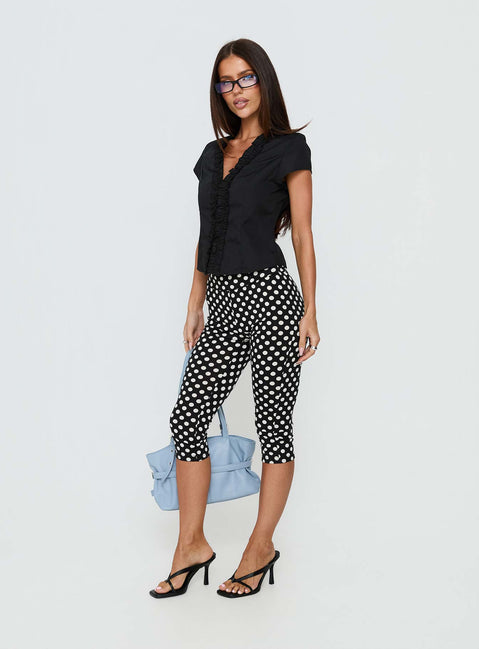 back view of model wearing Princess Polly Isadonna Capri Pants Black Polka Dot Mid Rise Pants 