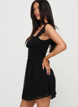 side view of model wearing Princess Polly So Sweet Mini Dress Black Sweetheart Neckline 