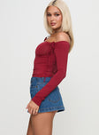   side view of model wearing Princess Polly Nicolina Low Rise Denim Mini Skirt Light Wash Mini Skirts 