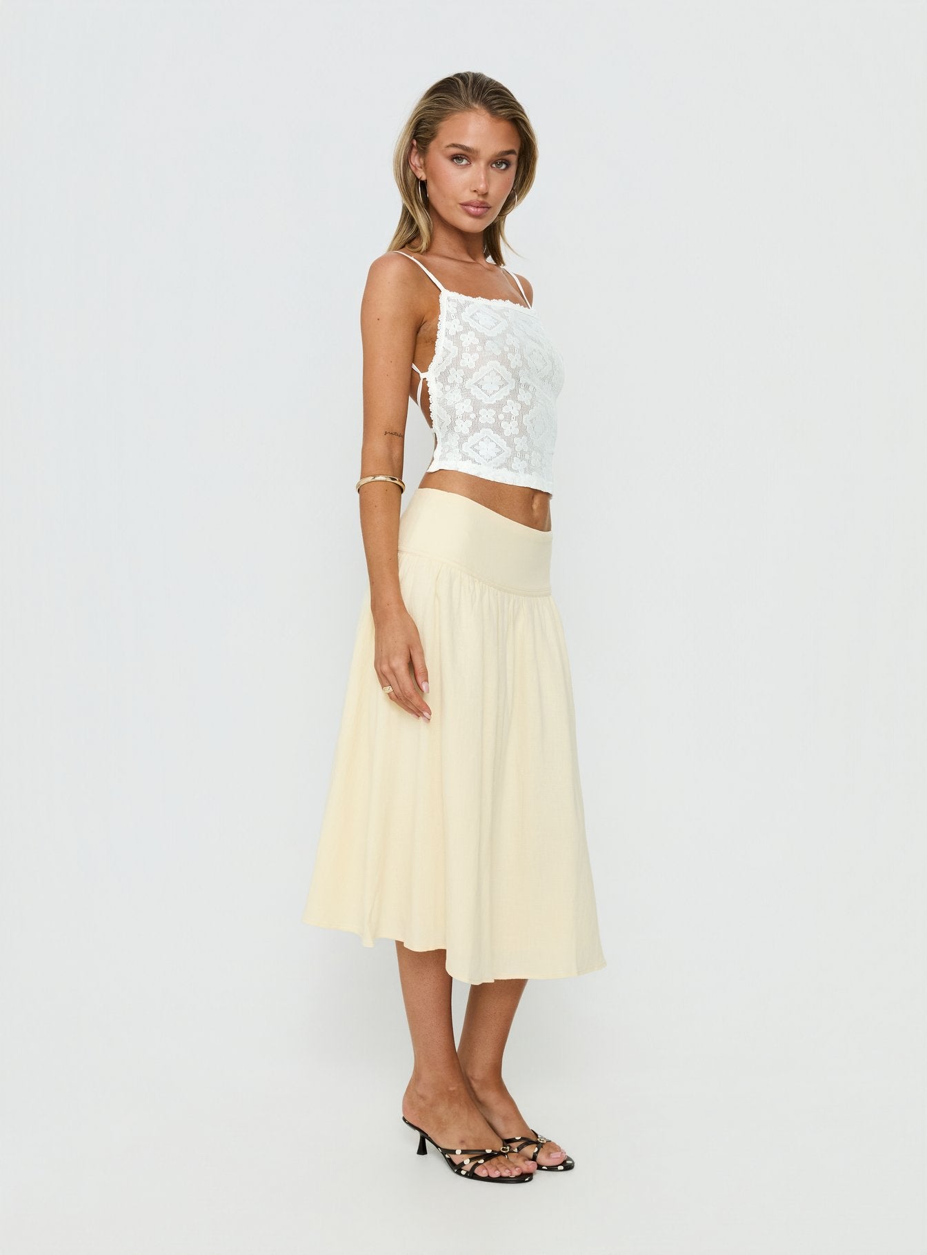   side view of model wearing Princess Polly Heart Of Gold Linen Blend Midi Skirt Lemon Midi Skirts 