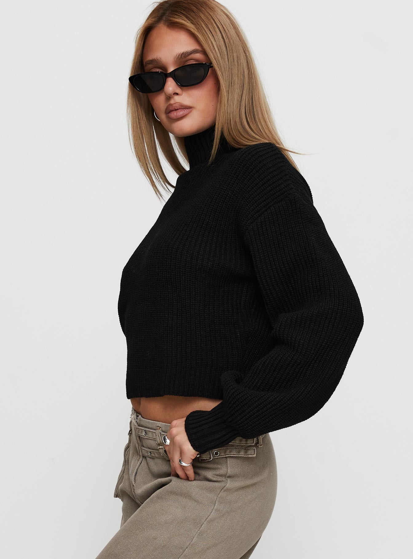 side view of model wearing Princess Polly Sayge Mock Neck Knit Sweater Black cropped 