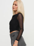 side view of model wearing Princess Polly Valette Mesh Long Sleeve Top Black Full Sleeves Cowl 