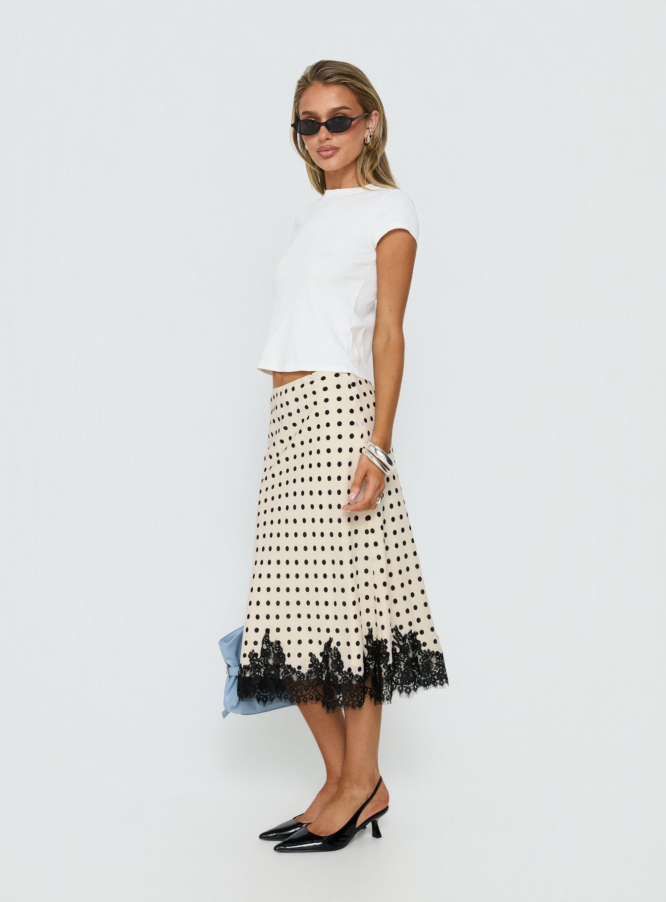   side view of model wearing Princess Polly Downtown Scene Lace Trim Maxi Skirt Cream Polka Midi Skirts 