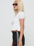 side view of model wearing Princess Polly Ive Got Sunshine Top White Short Sleeves V-Neck 