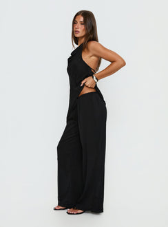 side view of model wearing Princess Polly Emorisa Mid Rise Chiffon Pant Black Mid Rise Pants 