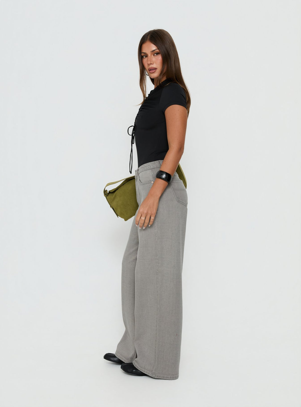 Capturing Naylor Mid Rise Wide Leg Jeans Light Grey Wash in womens-jeans side view of model wearing Princess Polly