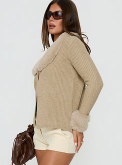 Designed with the Gisele Faux Fur Trim Long Sleeve Sand womens jumper in short length side view of model wearing Princess Polly