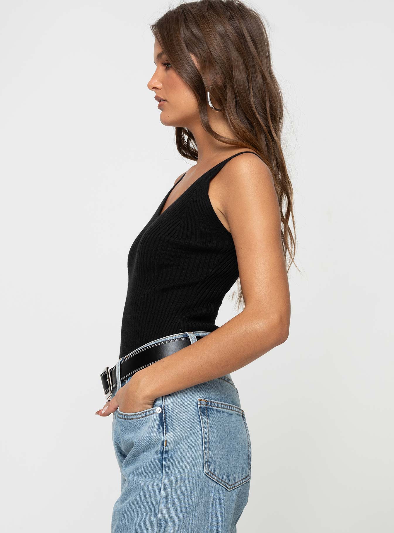 side view of model wearing Princess Polly Keenan Bodysuit Black Sleeveless V-Neck 