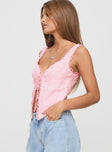 Pink broderie anglaise Fixed shoulder straps, v-neckline, tie fastening at front, split hem