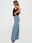 side view of model wearing Princess Polly Colemane Mid Rise Denim Jeans Angel Blue High Waisted 