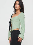 side view of model wearing Princess Polly Mani Long Sleeve Top Green Full Sleeves Sweetheart 