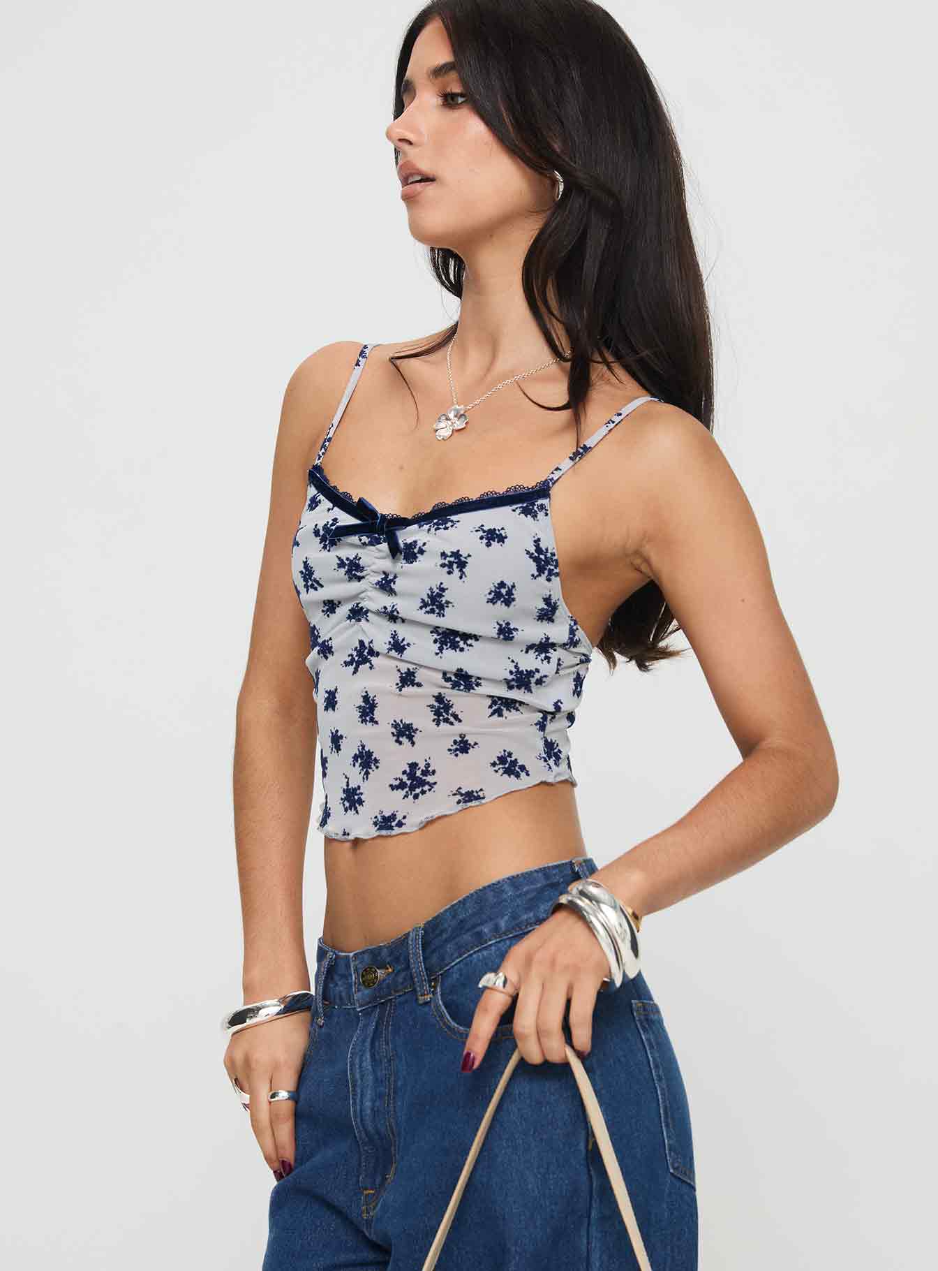 side view of model wearing Princess Polly Norde Top Floral Cluster Pale Grey Sleeveless V-Neck 