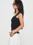 side view of model wearing Princess Polly Caspian Top Black Sleeveless Square Neck 