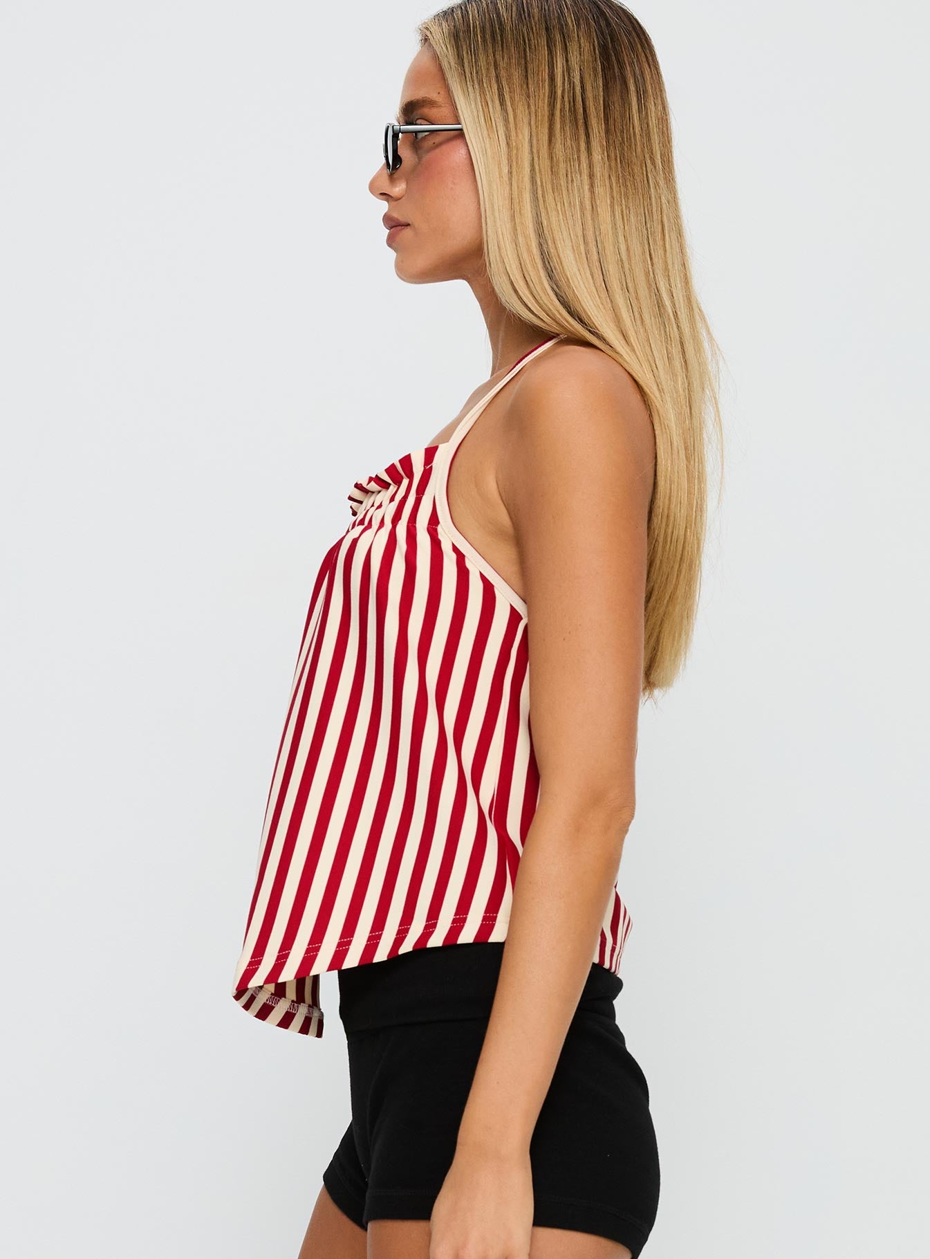 side view of model wearing Princess Polly Full Of Flash Top Red Stripe Sleeveless Square Neck 
