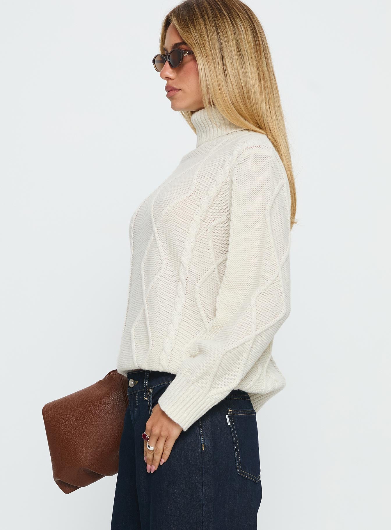 side view of model wearing Princess Polly Tarynne Cable Knit Turtle Neck Sweater Beige Long 