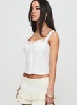 side view of model wearing Princess Polly Hatching Top White Sleeveless Sweetheart 