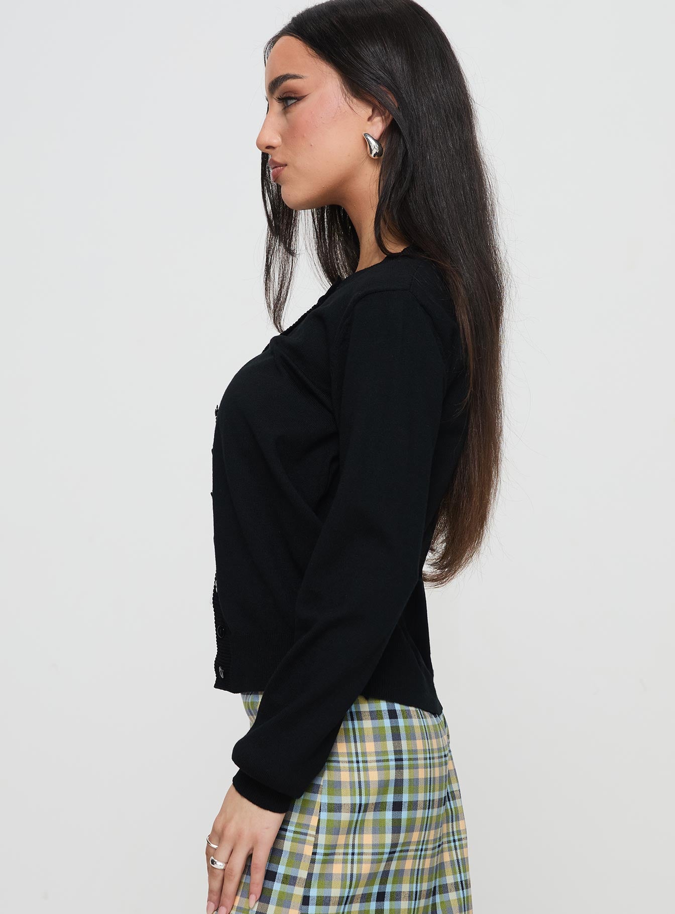 side view of model wearing Princess Polly Capeside Knit Cardigan Black Cropped 
