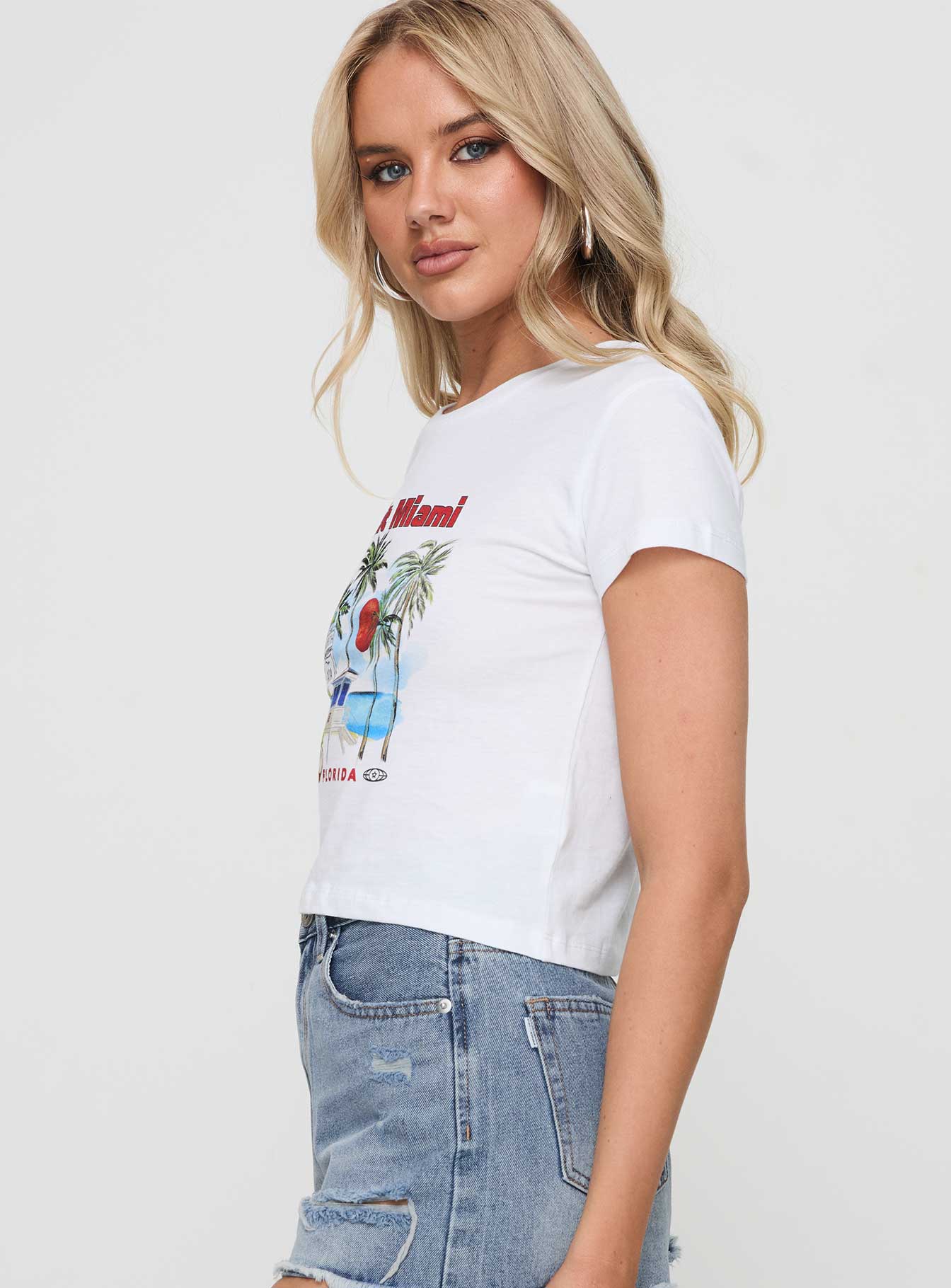 side view of model wearing Princess Polly Visit Miami Graphic Tee White Short Sleeves Crew Neck 
