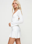 side view of model wearing Princess Polly Sybella Long Sleeve Mini Dress White V-Neck 