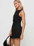 side view of model wearing Princess Polly Anse Mini Dress Black Boat Neck 