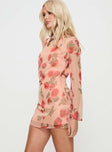 side view of model wearing Princess Polly Florinda Long Sleeve Mini Dress Pink Floral High Neck 