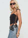 side view of model wearing Princess Polly Dalloren Denim Cargo Top Black Sleeveless Square Neck 