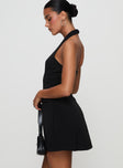 side view of model wearing Princess Polly Emanuela Halter Mini Dress Black V-Neck 