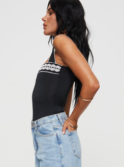 side view of model wearing Princess Polly Keating Bodysuit Black Tall Sleeveless 