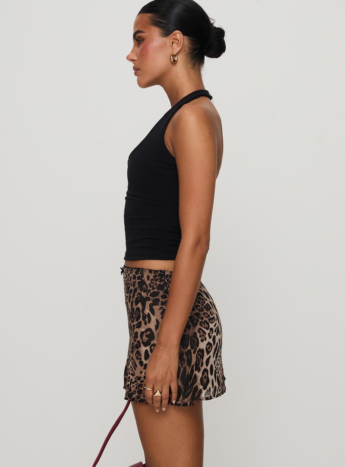   side view of model wearing Princess Polly Tejano Mini Skirt Leopard Tall Mini Skirts 